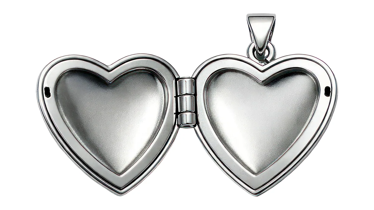 A round silver locket hanging open on its chain, the two halves parting to show the dark interior.